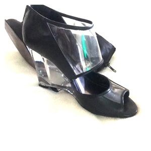 Glass heel to toe, black designer shoes from Aldo